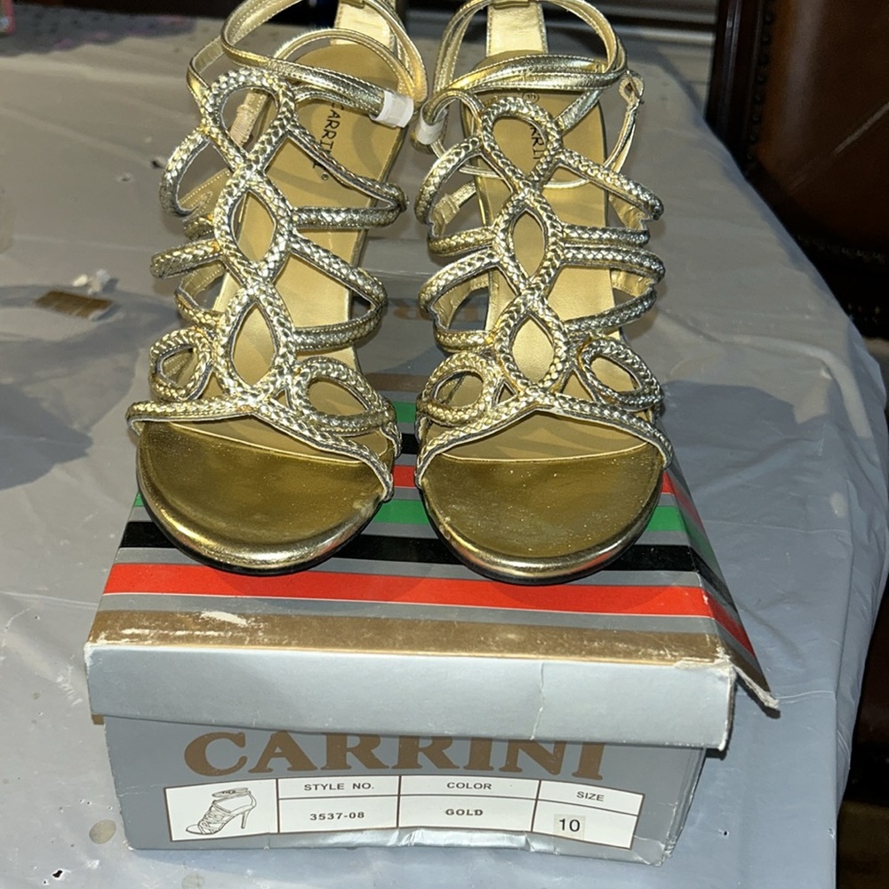 Carrini gold straps around the ankle toe out sandal $15